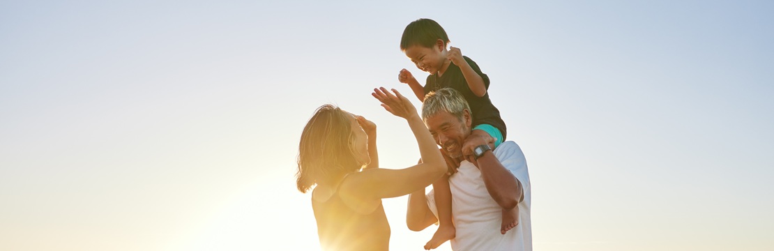 Family enjoying time together on the beach, reflecting the multigenerational planning and legacy-building benefits of 529 savings accounts beyond college funding.